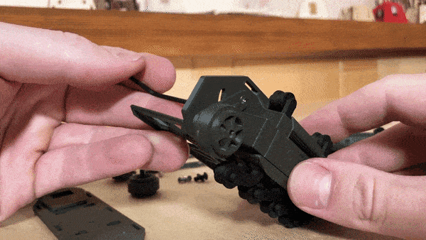 Adjusting the track tensioner